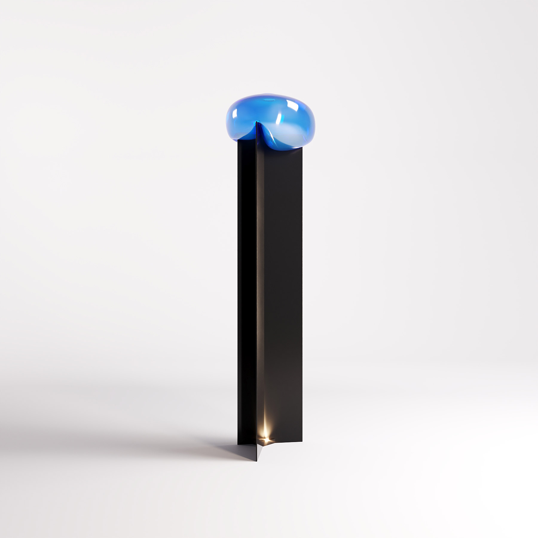 Yalux — A floor lamp where Murano glass rests on a sculptural metal structure